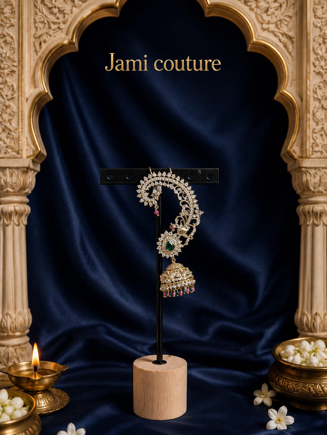 Single antique gold peacock ear cuff earring on a stand, showing its curved cuff