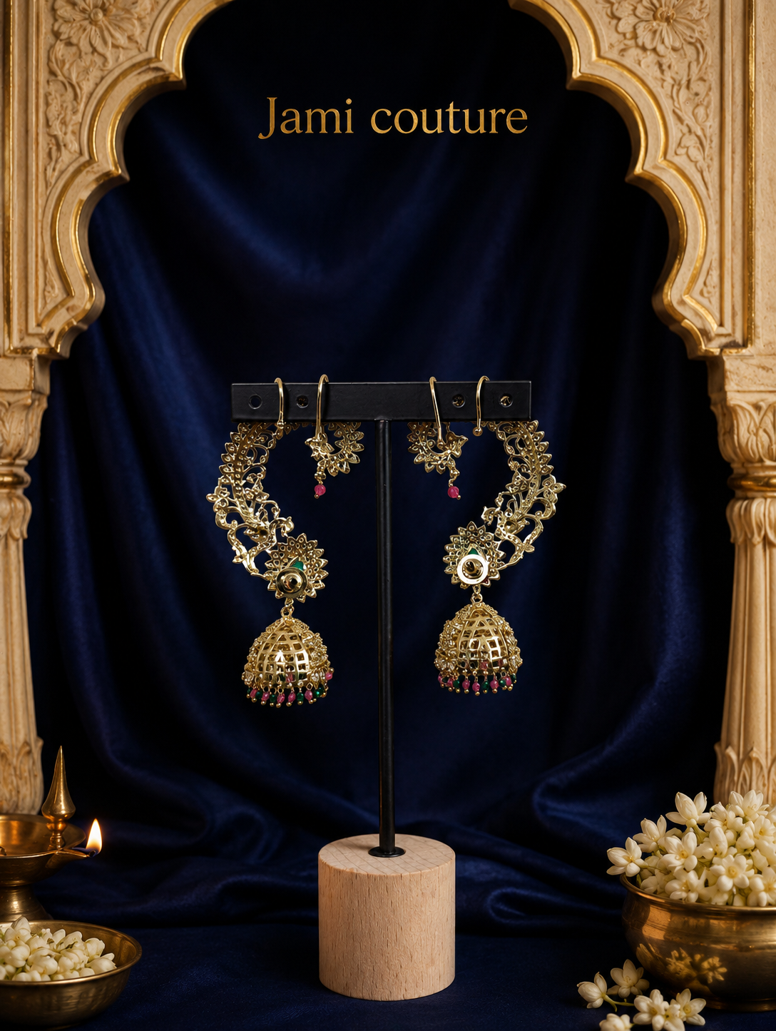 Peacock ear cuff jhumka earrings on a stand against a navy backdrop