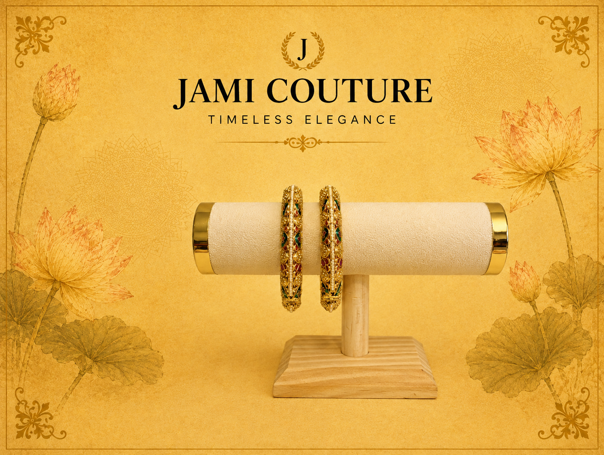 Antique gold openable bangles with ruby and emerald stones displayed on a bangle bar