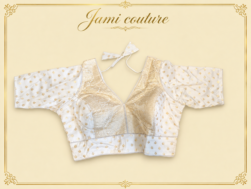 White pure dola silk Banarasi designer blouse with silver-gold buttis, laid flat