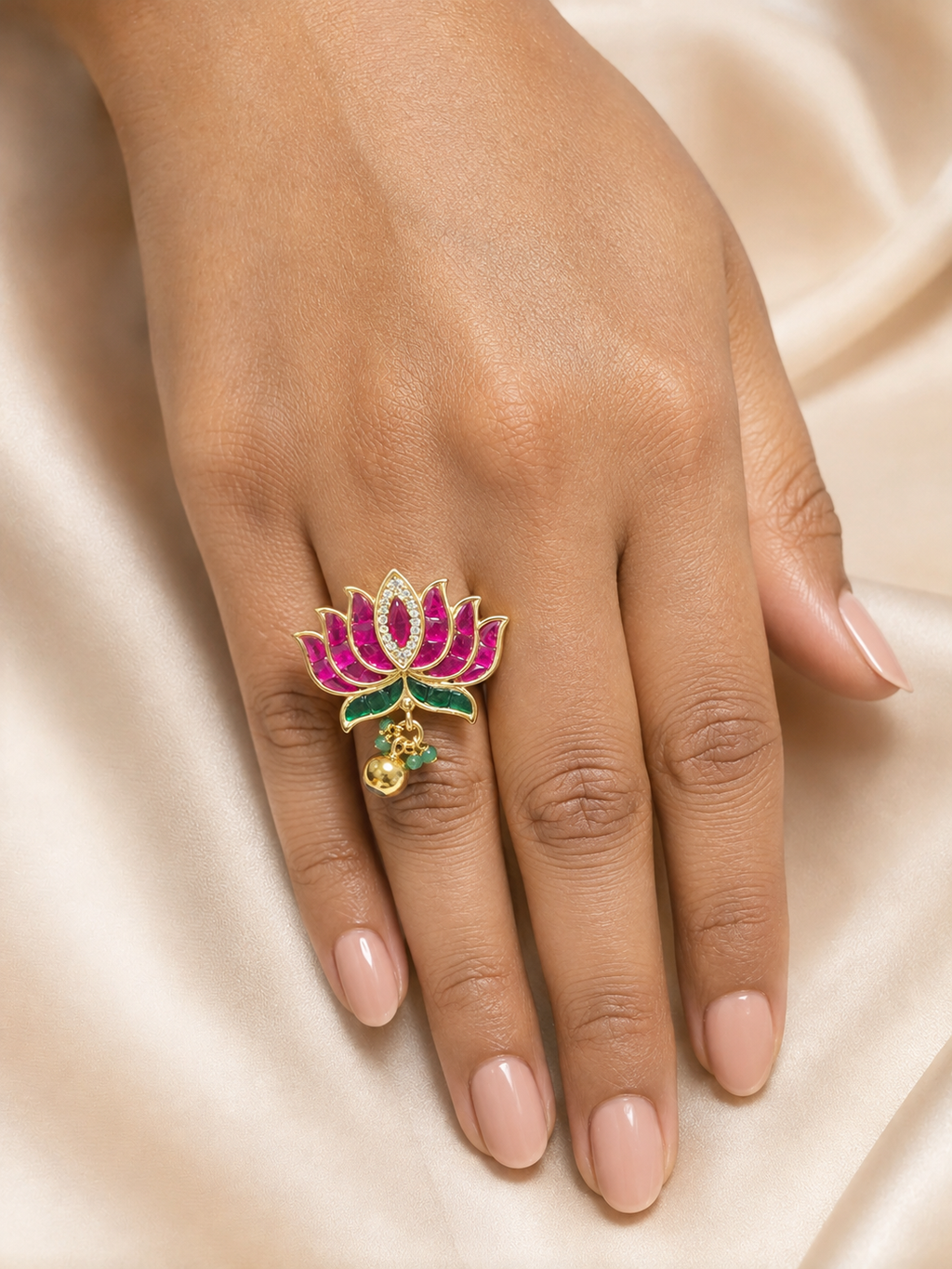 Model wearing the ruby and emerald lotus jadau statement ring