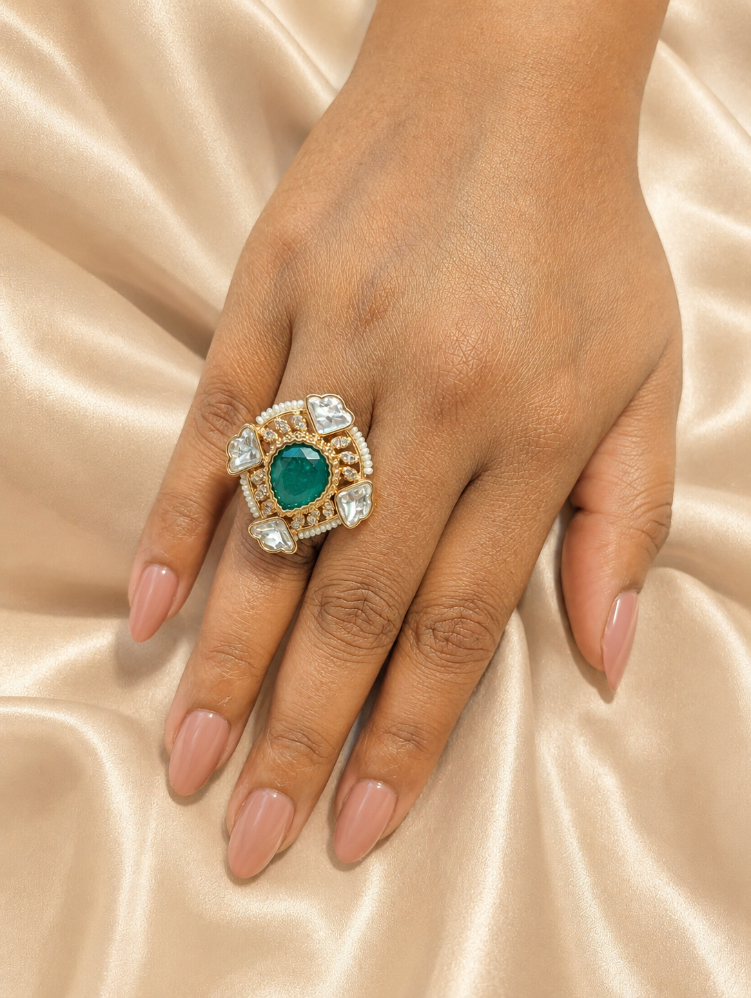 Model wearing the emerald green and polki kundan statement ring