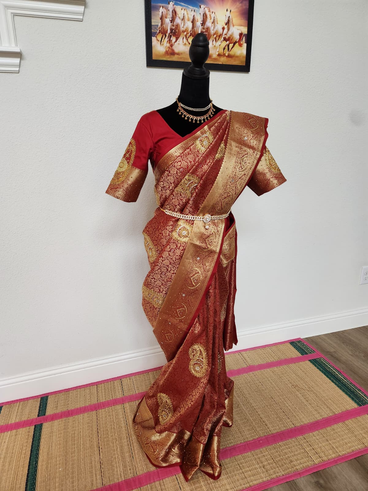 Natural-light front view of the red semi silk zardosi saree with matching red blouse and waist belt