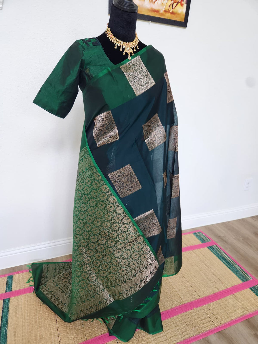 Natural-light three-quarter view of the bottle green Kanchi cotton saree and matching blouse