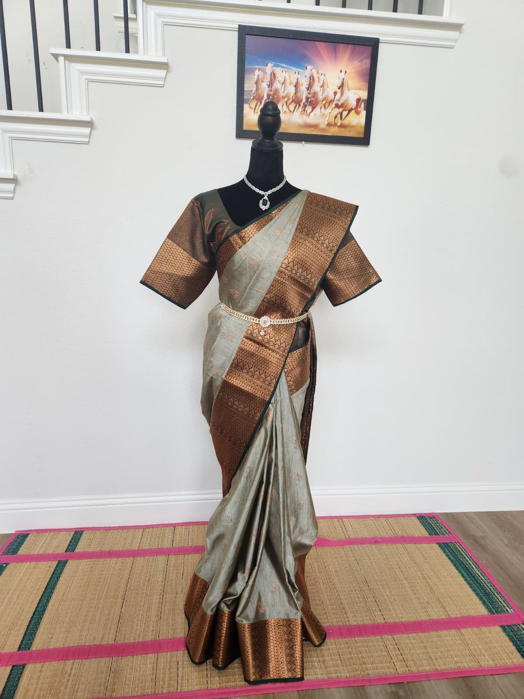 Natural-light full-length front view of the grey and copper handloom silk saree